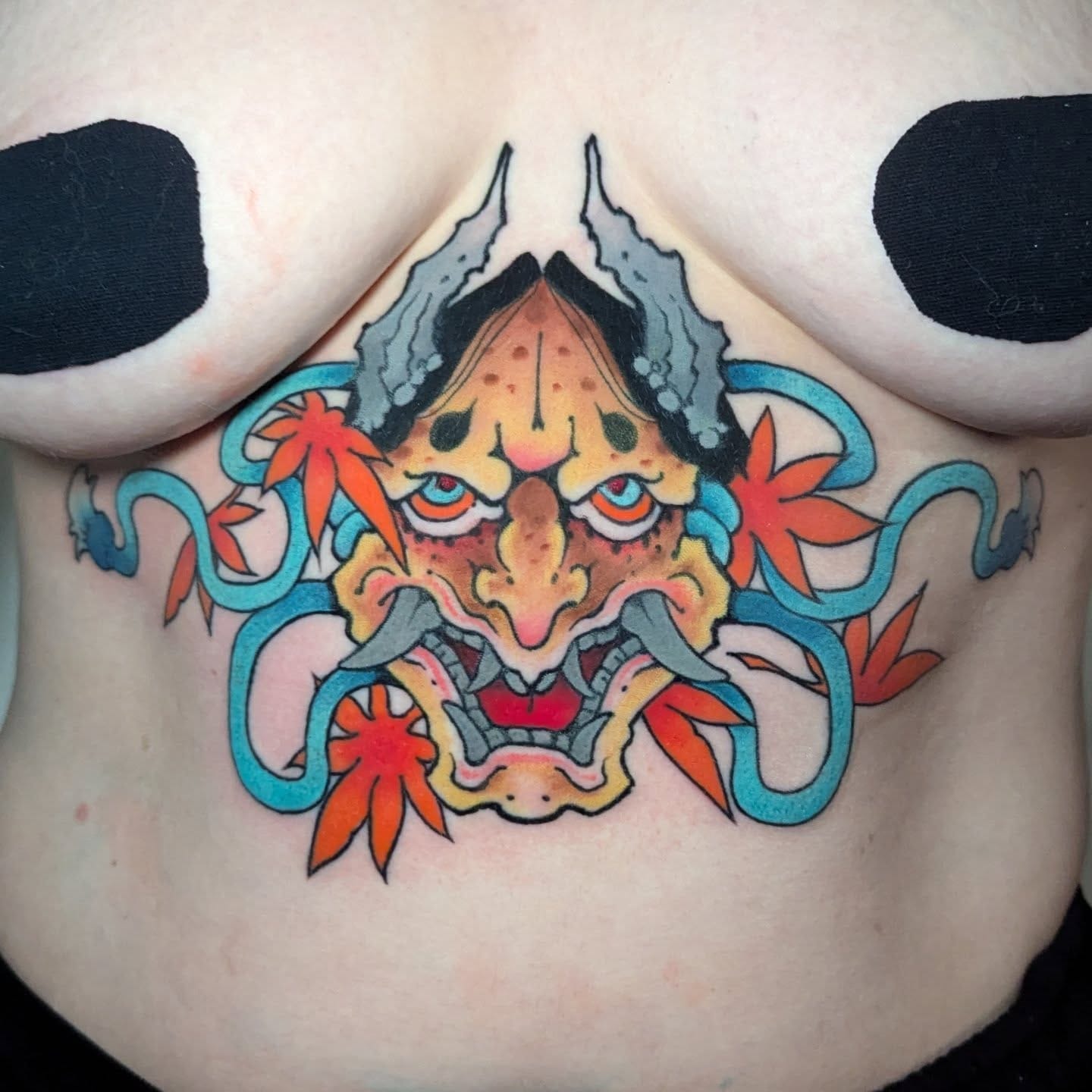 Argustattoo jarrat underboob demon, tattoo by Jarrat Tattoo at Argus Tattoo in Antwerp